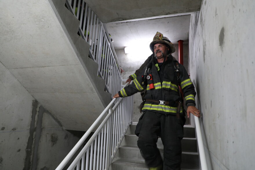 Jason Martino takes part in the 9/11 stair climb on Navarre Beach.