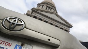 A car registration tab is shown on a vehicle parked at the Capitol, Wednesday, Feb. 12, 2020, in Olympia, Wash. The Washington Supreme Court unanimously struck down Tim Eyman's Initiative 976 in a ruling issued Thursday. 