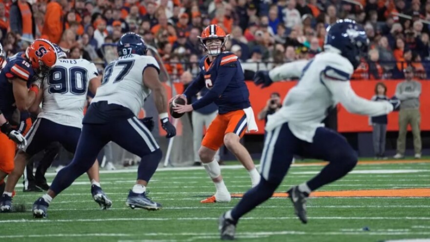 Syracuse quarterback Kyle McCord (6, Blue) fires one of his 47 pass attempts against UConn.