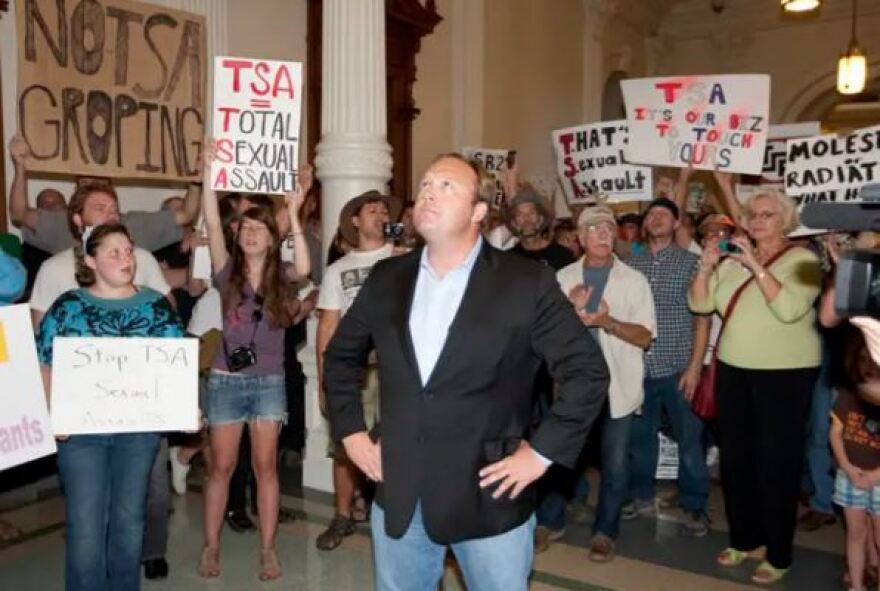 Jones stands with anti-TSA protesters outside the U.S. House chamber after lawmakers tentatively passed airport anti-groping legislation in 2011.