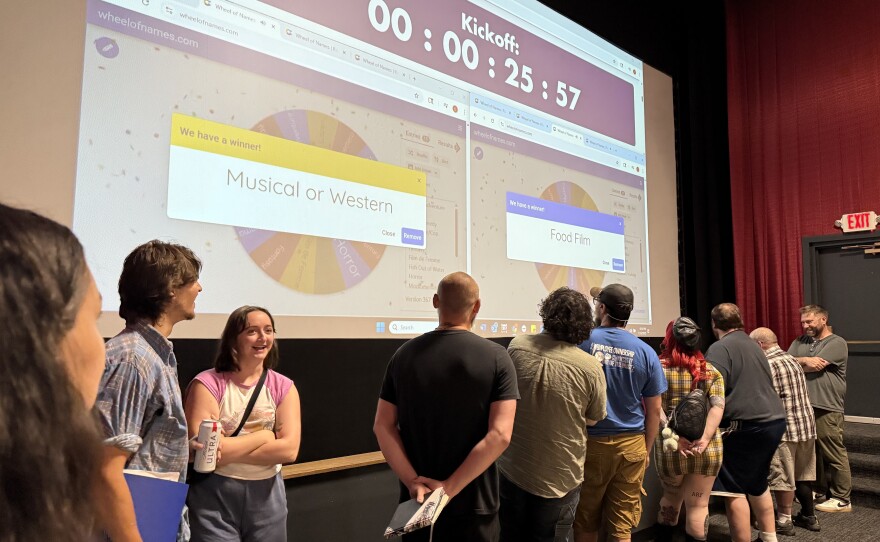 Teams competing in the 48 Hour Film Project sent a representative up to the screen to spin the wheel. Whichever genre and topic popped up on the wheel would be their team's framework for the weekend of filmmaking.
