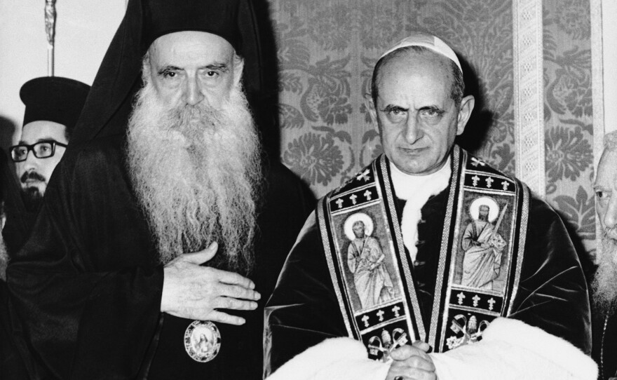 Pope Paul VI of the Roman Catholic Church and bearded Orthodox Patriarch Athenagoras of Constantinople pose during a historic meeting on Jan. 8, 1964, on the Mount of Olives in a part of Jerusalem that was controlled by Jordan at the time. It was the first meeting between leaders of the split church since the East-West Schism of 1054.