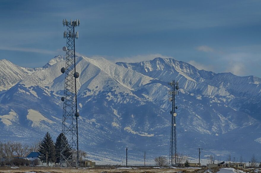 Cell phone and rural broadband towers in Alamosa County, Colorado with the Sangre de Cristos in distance on Jan. 22, 2021.