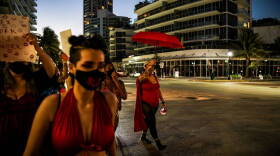 Activists and sex workers march in the streets of Miami Beach for the decriminalization of sex work on December 5, 2020. (Photo by CHANDAN KHANNA/AFP via Getty Images)