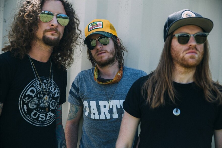 The Cadillac Three — (left to right) lap steel player Kelby Ray, singer-guitarist Jaren Johnston, and drummer Neil Mason — resonates with country and rock 'n' roll in equal parts.