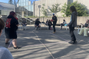 Group of people with a ball outside.