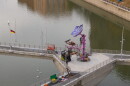 A crew installs the new city-mark-themed sculpture on the Sister Cities Bridge in downtown Rochester.