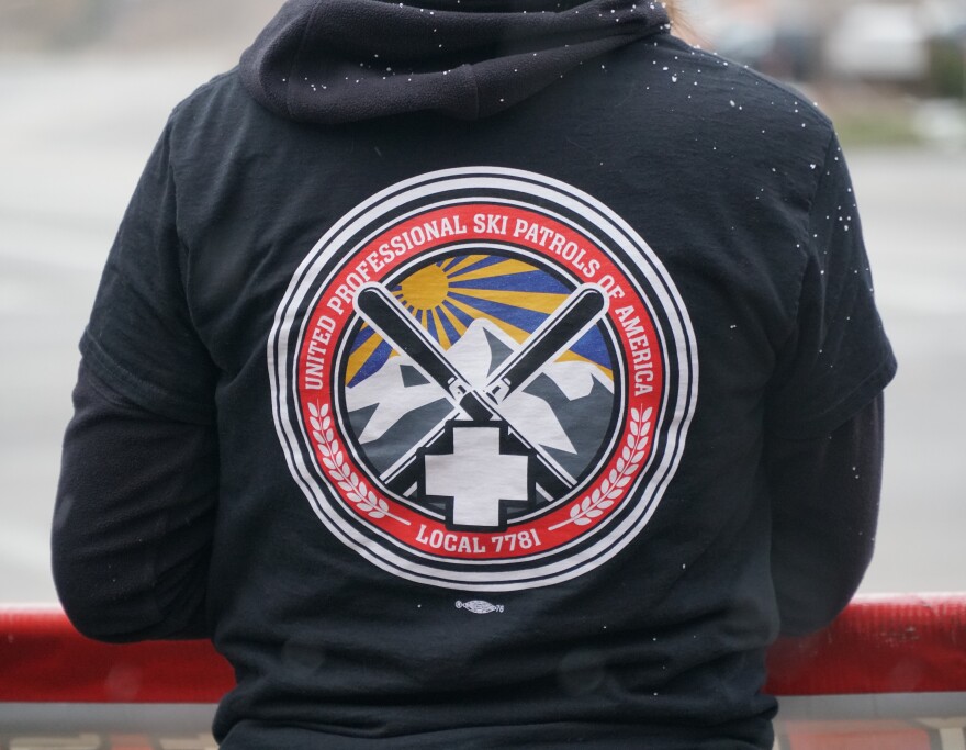 About 65 ski patrollers, mountain safety staff and supporters practice picket to urge the Park City Mountain to move toward a contract resolution.