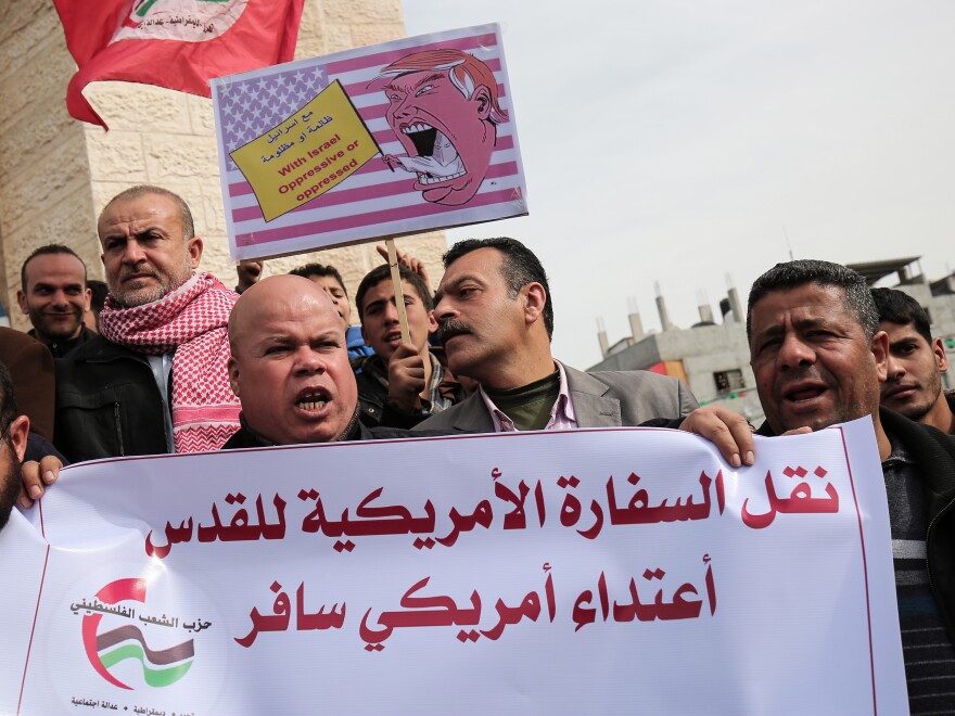 Palestinian demonstrators protest President Trump's pledge to move the U.S. Embassy to Jerusalem, in Rafah in the southern Gaza Strip in January. The sign in Arabic reads: "Moving the U.S. Embassy to Jerusalem is a flagrant aggression."