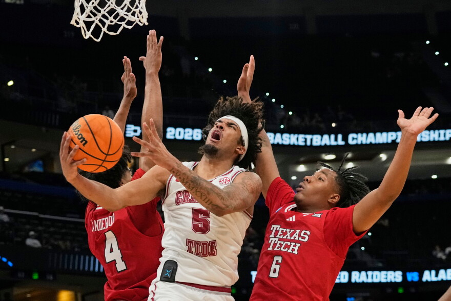 FILE - Alabama forward Amari Allen (5) makes a shot as he gets between Texas Tech guard Christian Anderson (4) and guard Leon Horner (6) during the second half in the second round of the NCAA college basketball tournament, March 22, 2026, in Tampa, Fla. (AP Photo/John Raoux, File)