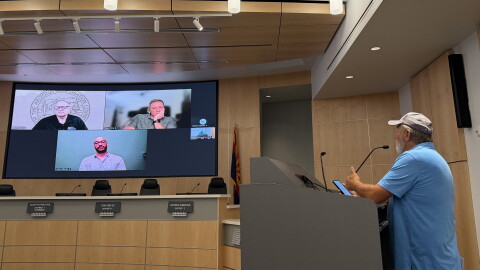 Yuma County resident Gary Skinner, right, speaks to Arizona Corporation Commission Chairman Nick Myers, upper left, at a public meeting on private water system concerns on Wednesday, Oct. 28, 2026 at the Yuma County Board of Supervisors Auditorium.
