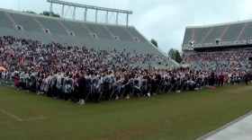 Virginia Tech graduates celebrate after Friday's ceremony.