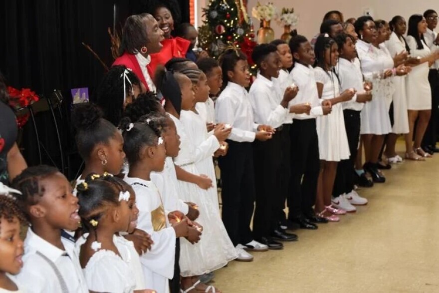 A line of kids singing in Church