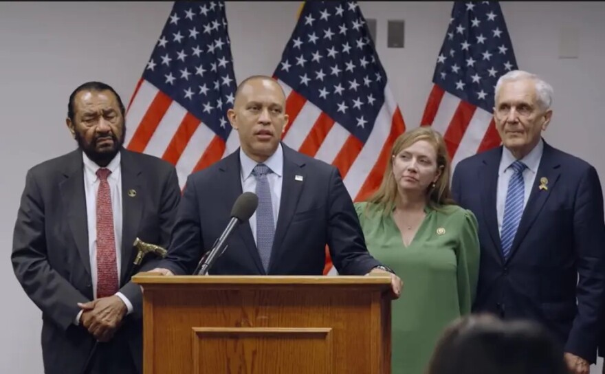 U.S. House Minority Leader Hakeem Jeffries (D-NY, at podium), flanked by U.S. Reps. Al Green (D-Houston), Lizzie Fletcher (D-Houston), and Lloyd Doggett (D-Austin).