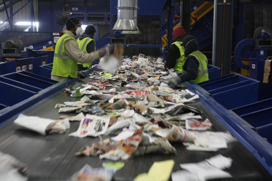 Workers at a Rumpke recycling facility. 