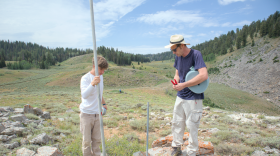 András Dobos (left) and Utah State University graduate research assistant Tim Wright install a temperature sensor at Peter Sinks in Logan Canyon on July 29, 2026.