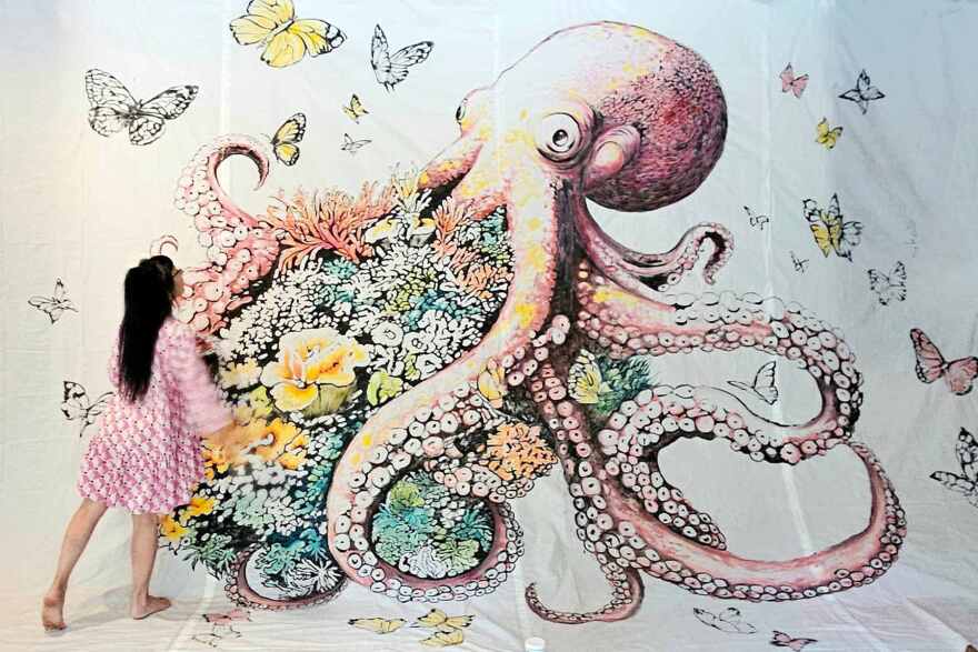 Artist Mariapia Malerba works on BIG ARTS mural 