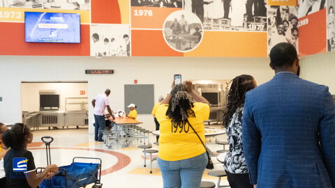 Alumni, staff and community members tour the new John F. Kennedy Middle School on July 31, 2026, in Suffolk, Virginia.