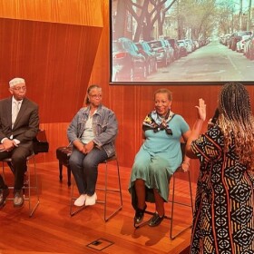 James Blake (left) and Denise Pease (second from right) talking to Regina Bain (far right) about their Corona neighborhood