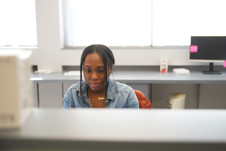 Aubrey Clenna, a women's health nurse practitioner at the Village of Healing, works at the nonprofit's office on Shaker Boulevard on Cleveland's East Side.