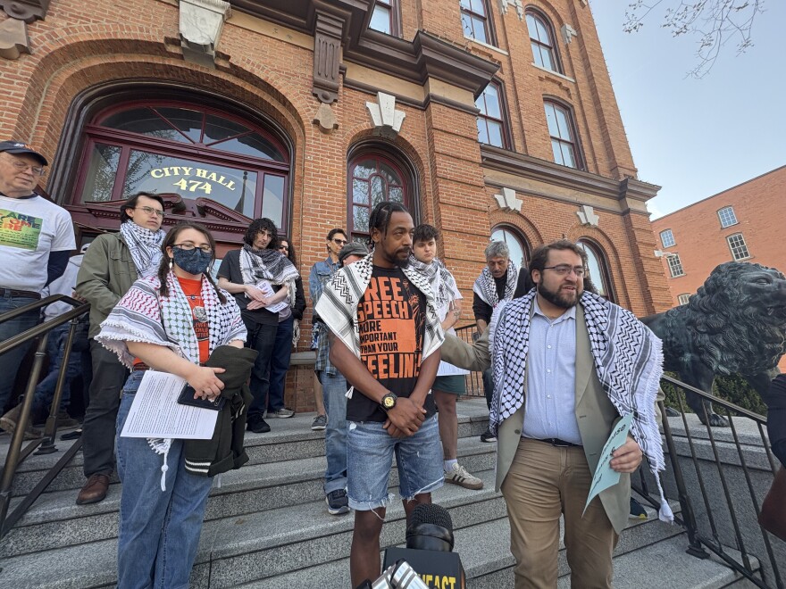 Lex Figuereo and Eyad Alkurabi on the steps of Saratoga Springs' city hall after appearing in court over allegedly organizing a protest without proper permits