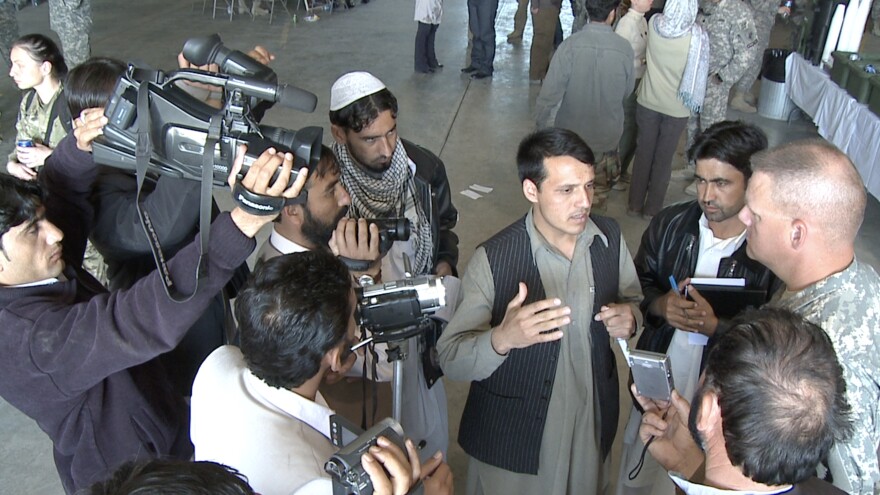 Saifullah interpreting at a press conference