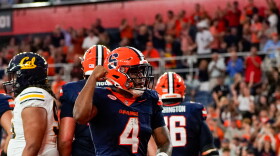 Syracuse running back Ju’Juan Johnson (4, Navy) celebrates in the end zone following his first score of the year.