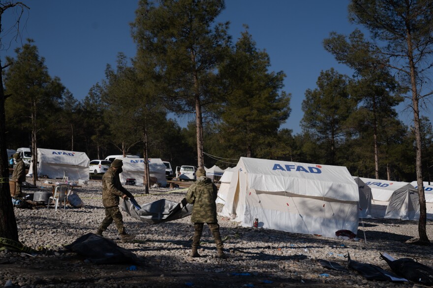 Bodies are moved to a mass grave site in Kahramanmaras, Turkey, where they are washed and buried.