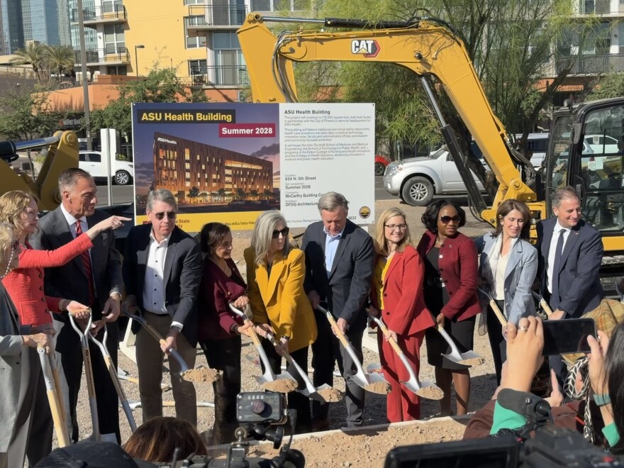 Arizona Gov. Katie Hobbs (yellow jacket) joins Phoenix and Arizona State University leaders at a ceremonial groundbreaking for ASU's new medical school in downtown Phoenix on Thursday, April 9, 2026.
