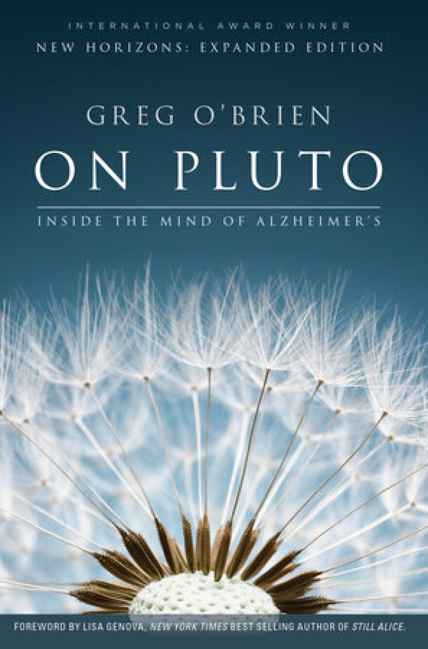 A blue book cover with the author Greg O'Brien's name and the title "On Pluto: Inside the Mind of Alzheimer's." An image of a dead dandelion is at the bottom of the cover. 