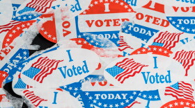 Concept for the end of the election in the USA with torn and scratched campaign buttons on glass