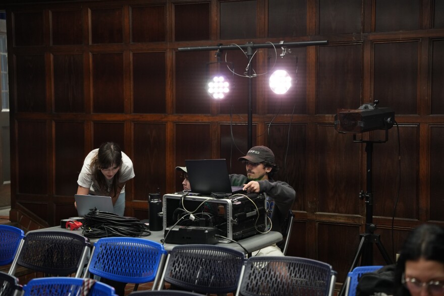 The "Prodigal Son" show crew sets up lighting and sound prior to rehearsal. Both the ensemble and production have been preparing the show for weeks. (Alexis Vivanco/WUFT News)