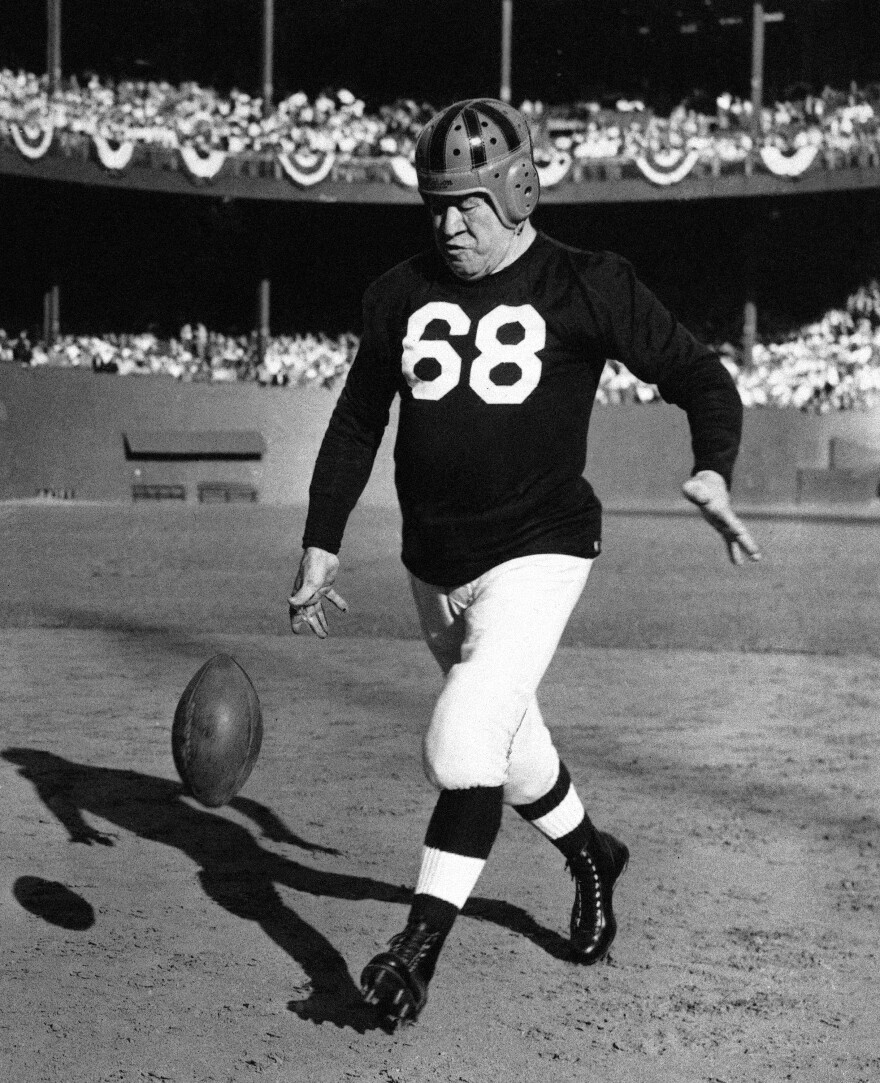 FILE - Jim Thorpe, famous all-around athlete, is shown giving a drop-kicking exhibition at New York's polo grounds on Sept. 26, 1948, between halves of the Israel-U.S. international soccer match. (AP Photo, File)
