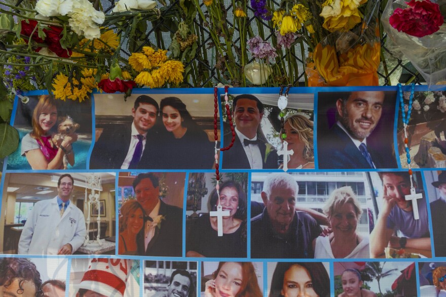 A memorial in Surfside, Fla., contains pictures of some of the missing from the collapsed condo building. Over 100 people are still unaccounted for as the search and rescue efforts continue.