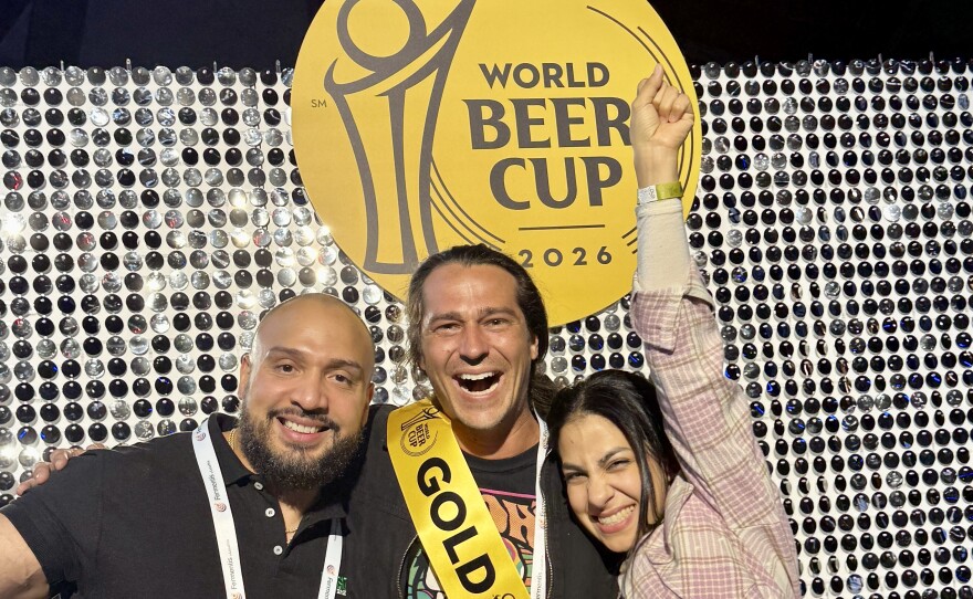 From left to right, Darlyn Victor, Tripp Allen, and Ana Rodriguez de Vera (the queen), at the World Beer Cup finalist ceremony at the