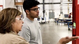 Chris Camacho, a youth apprentice in Elkhart County, learns about the operations of the factory on his first day.
