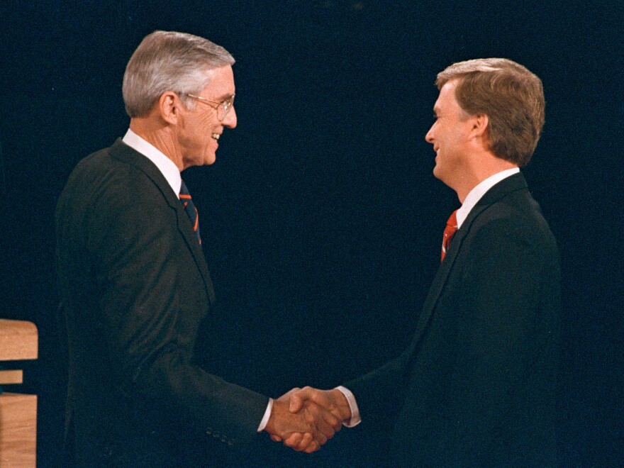 Sen. Lloyd Bentsen (D-Texas) shakes hands with Sen. Dan Quayle (R-Ind.) before their vice presidential debate at the Omaha Civic Auditorium in Omaha, Neb., on Oct. 5, 1988.