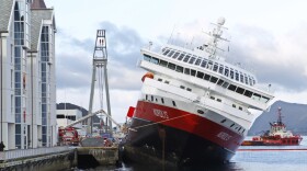 The MS Nordlys sits stricken in the water at Aalesund in western Norway.