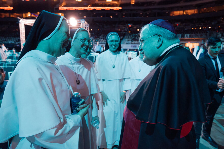 Timothy Dolan, the former Archbishop of New York and St. Louis-native, converses with the Dominican Sisters of Mary Mother of the Eucharist ahead of the beatification Mass for the late Archbishop Fulton J. Sheen on Thursday,.