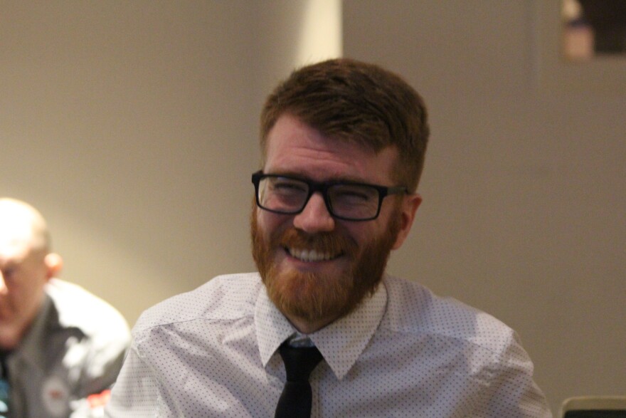 Joey Sweet smiles moments after he was selected to serve on the Anchorage Assembly on Jan. 6, 2023. (Wesley Early/Alaska Public Media)