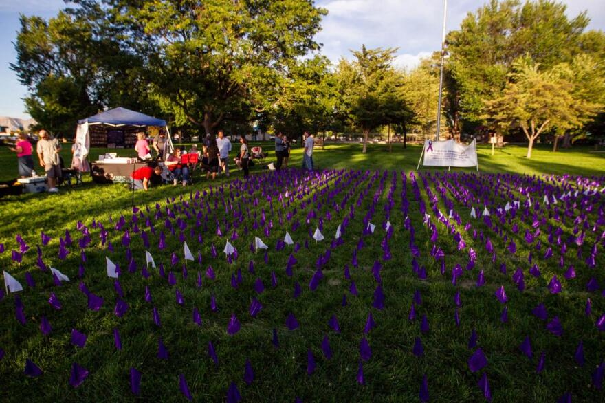 More than 1,800 purple and white flags representing Coloradans who died from overdose last year covered a portion of Lincoln Park for a display to commemorate National Overdose Awareness Day and offer those impacted by overdose the opportunity to remember and honor those lives with a candlelight vigil on Wednesday, August, 28, 2024.