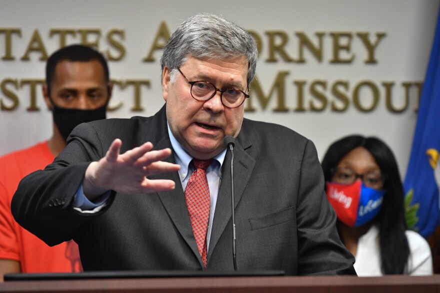 U.S. Attorney General William P. Barr is flanked by the parents of LeGend Taliferro, Raphael, left, and Charron, as he addresses the media Wednesday at the Charles Evans Whittaker Courthouse. Barr was in Kansas City to update the progress of Operation LeGend.