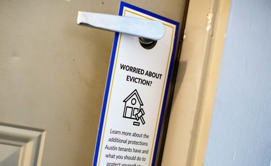 The door hangers tell tenants in English and Spanish where they can read about current eviction protections during the pandemic.