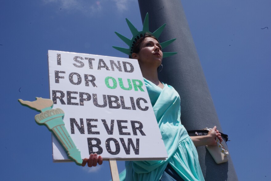 Close up of the woman in the statue of liberty costume.