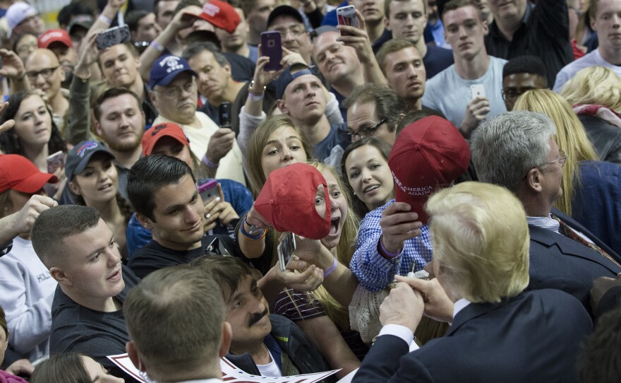Then-Republican presidential candidate Donald Trump works a rope line after speaking during a campaign stop at the First Niagara Center in Buffalo, N.Y., in 2016. (AP Photo/John Minchillo)