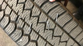 A tire punctured with nails in Portland. North Texas law enforcement says a "nail bandit" who's littered streets with roofing nails has been arrested.