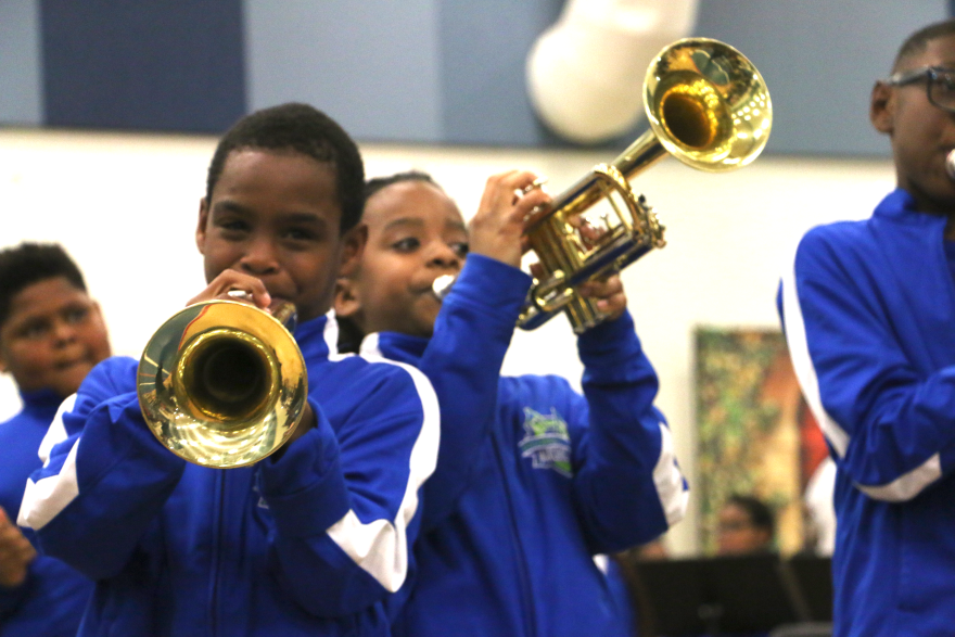 Dolores T. Aaron students Ty'ron Martin (left) and Donovan Dubart play trumpet in the school brass band.
