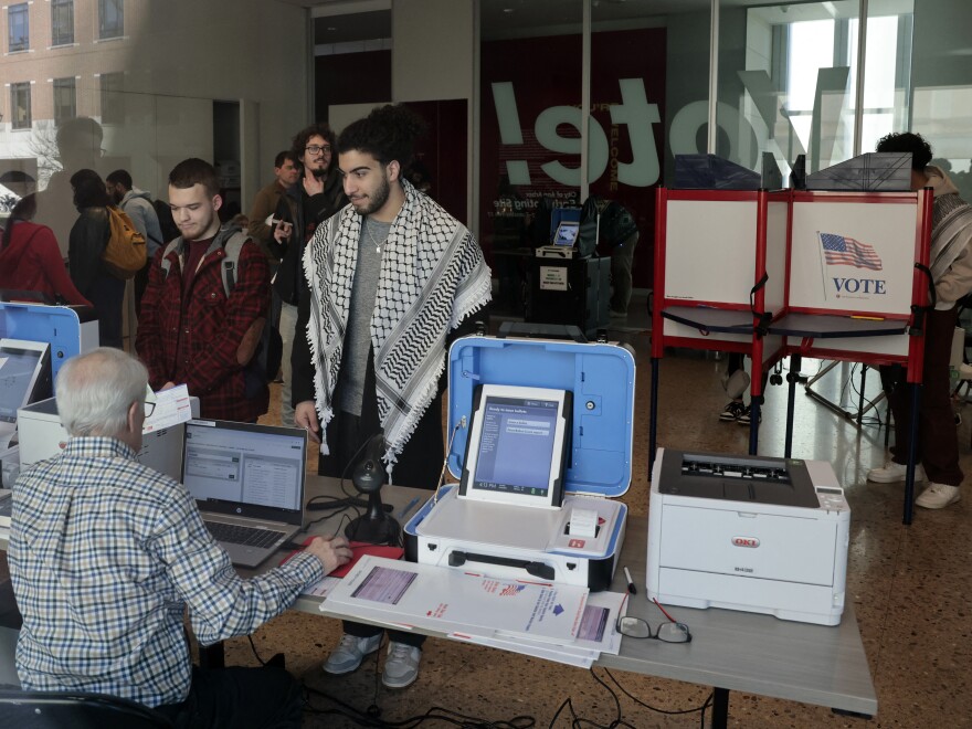 People cast their ballots during early voting in the state's primary in Ann Arbor, Mich., on February 20, 2024