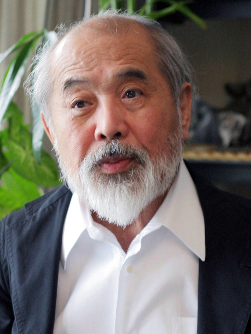 A 2004 photo shows Japanese industrial designer Kenji Ekuan. The creator of a classic soy sauce bottle and other products died at a hospital in Tokyo on Sunday. He was 85.