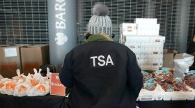 A furloughed Transportation Security Administration employee at a food distribution spot for federal workers set up at the Barclays Center in Brooklyn, N.Y.